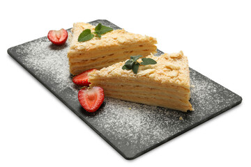 Board with pieces of Napoleon cake isolated on white background