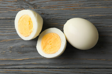 Hard boiled eggs on wooden background, close up