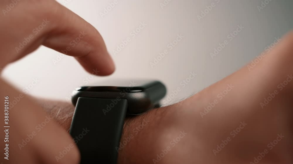 Aufkleber Man using smartwatch mobile app on touch screen. New gadget to view incoming messages and calls to a mobile phone. Stylish touchscreen wrist watches with navigation mobile application