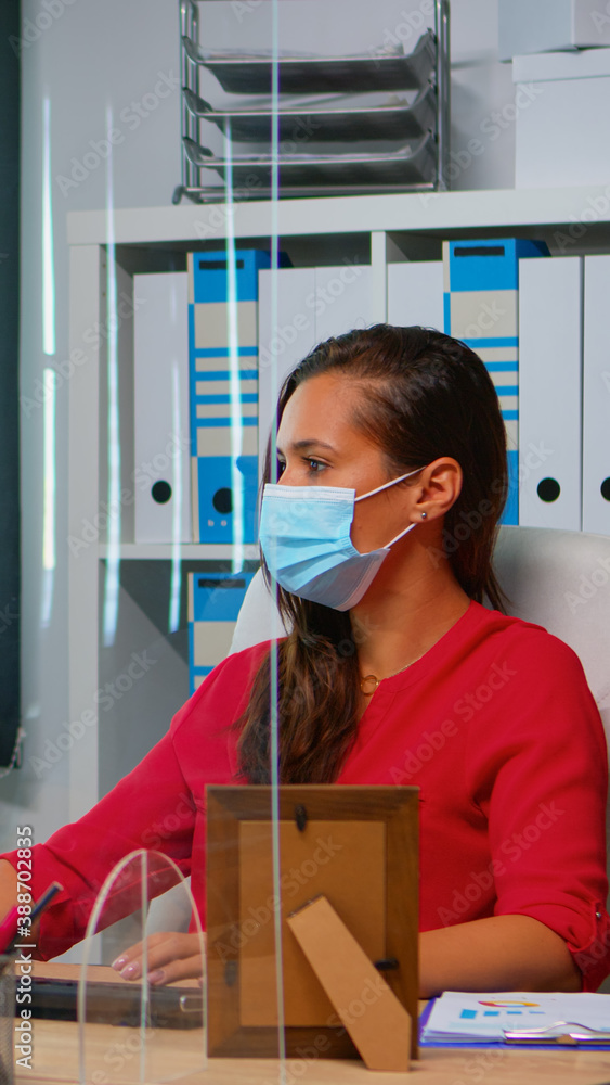 Poster people wearing face masks back at work in office with new normal. team working in workspace in perso