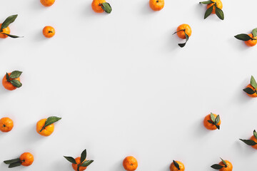 Naklejka na ściany i meble Ripe tangerines on white background top view