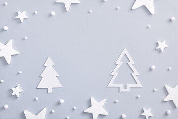 White star over pastel blue with white paper forest