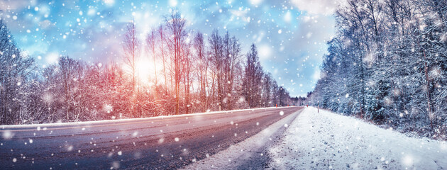 Winter road with snow and the trees all around