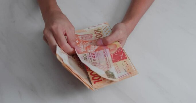 Count on Hong Kong banknote on table
