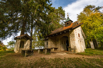 Fototapeta na wymiar Trinity Chapel on the hiking trail in the Danube Valley in colorful autumn near Beuron