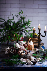 Obraz premium YULE LOG CAKE on a Christmas rustic background