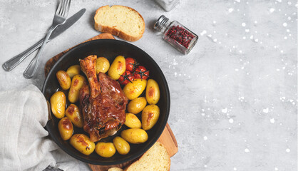 Homemade lunch roasted pork shank with potatoes. meat recipe