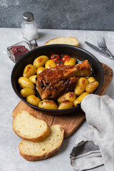 Homemade lunch roasted pork shank with potatoes. meat recipe