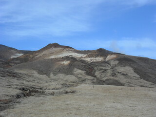 Hiking in the dark and dramatic nature of Iceland's volcanoes, mountains, fjords, geysers and waterfalls