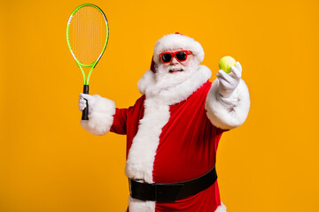 Portrait of his he nice attractive cheerful cheery glad Santa enjoying playing badminton hobby...