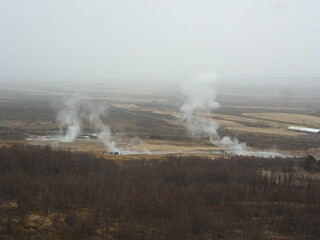 Hiking in the wild and dramatic landscapes of Iceland's snowy mountains, volcanoes, geysers, waterfalls and hot springs