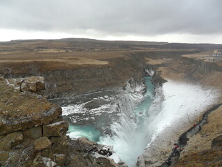 Hiking in the wild and dramatic landscapes of Iceland's snowy mountains, volcanoes, geysers, waterfalls and hot springs
