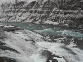 Hiking in the wild and dramatic landscapes of Iceland's snowy mountains, volcanoes, geysers, waterfalls and hot springs