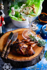 Honey-glazed quail with Waldorf salad  in a Christmas decor.