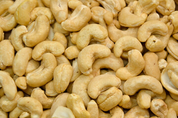 Fototapeta premium Cashew nuts. Cashew kernels. Clean organic nuts retro background. Organic healthy food.