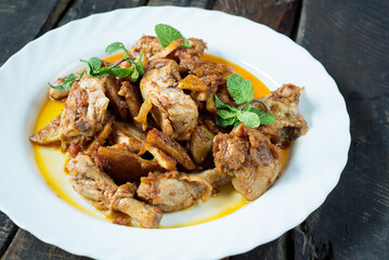 roasted chicken legs on a plate.