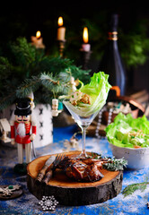 Honey-glazed quail with Waldorf salad  in a Christmas decor.