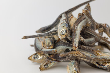 Dry anchovies on white background