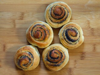 Buns with poppy seeds top view. Delicious baked goods