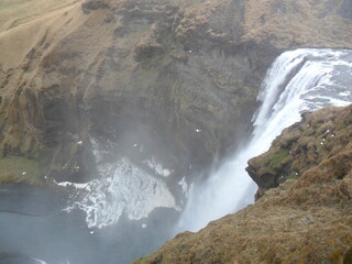 Hiking in the wild and dramatic nature among volcanoes, geysers, waterfalls, snowy mountains and hot springs in Iceland