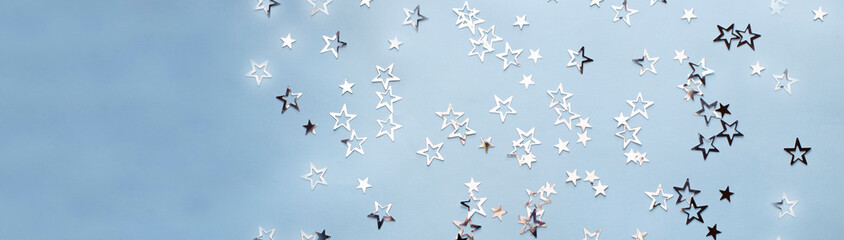 multiple silver stars on the blue background banner