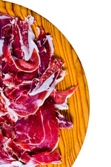 Portions of ham on wooden tray on white background