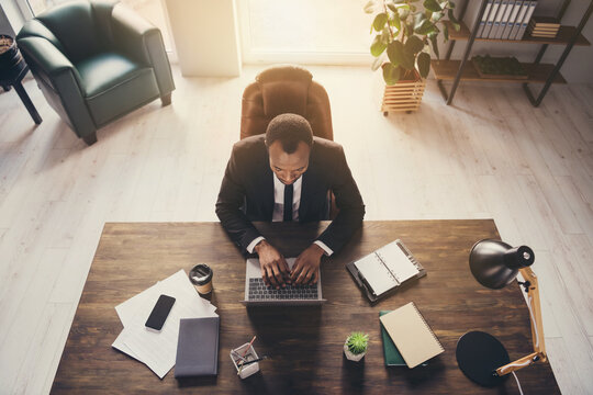 Top above high angle view of his he nice attractive classy chic skilled experienced guy copywriter ceo boss chief executive director sitting in chair writing article review at work place station