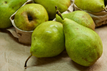 Pears background. Fresh pear fruit. Autumn fruits harvest on retro paper background. Organic farmers market products. Sweet, fresh and healthy food.