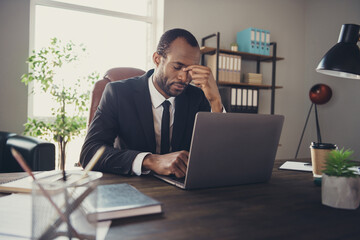 Portrait frustrated afro american collar guy sit desk work computer cant finish career innovation development startup presentation miss deadline feel head ache wear tux tuxedo in workstation