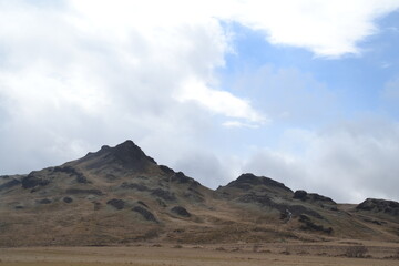 Hiking in the wild and dramatic nature of volanoes, snowy mountains, waterfalls, geysers and hot springs in Iceland