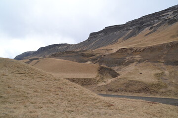 Hiking in the wild and dramatic nature of volanoes, snowy mountains, waterfalls, geysers and hot springs in Iceland