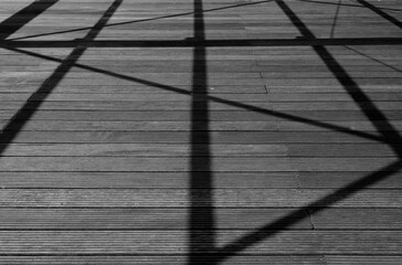 shadow pattern on wood floor