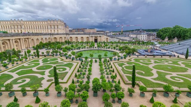 Famous palace Versailles with beautiful gardens and fountains timelapse from top. The Palace Versailles was a royal chateau. It was added to the UNESCO list of World Heritage Sites. Paris, France.