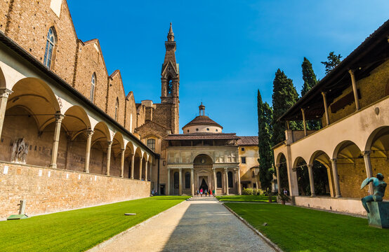 Beautiful view of the Pazzi Chapel, the first cloister with the bell tower of the Basilica di Santa Croce in Florence. The entryway is an arch with six columns topped by a loggia.