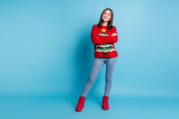 Full length photo of positive girl wearing christmas tree x-mas theme party jumper cross hands look copyspace isolated over blue color background