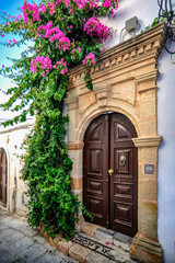 The small town of Lindos hides behind the mighty rock of the acropolis separating two coves with...
