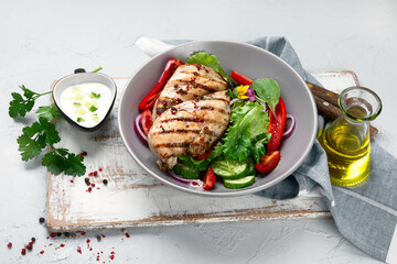 Grilled chicken fillet and vegetable salad