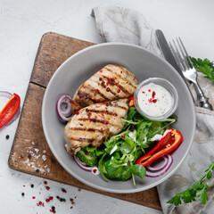Grilled chicken fillet and vegetable salad