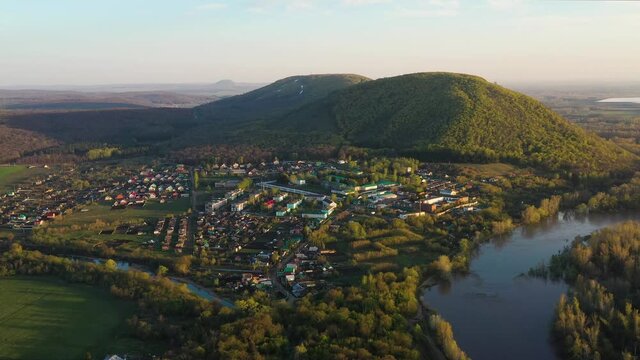 The remain of the reef of the ancient sea, composed of limestone - shikhan Kushtau on a spring day. Aerial view.