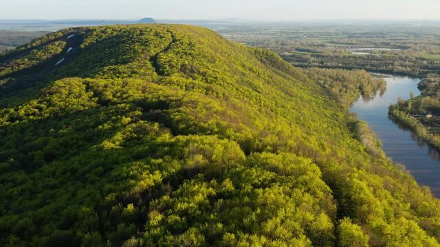 The remain of the reef of the ancient sea, composed of limestone - shikhan Kushtau on a spring day. Aerial view.