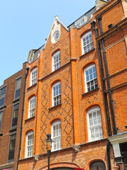 Fototapeta na wymiar London, UK. Red brick building in James Street at City of Westminster. 