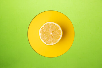 open lemon fruit on yellow and green background