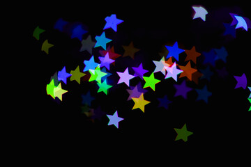 light colorful blue star light effect isolated overlay glitter texture on black.