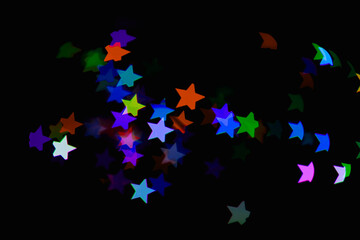 light colorful blue star light effect isolated overlay glitter texture on black.