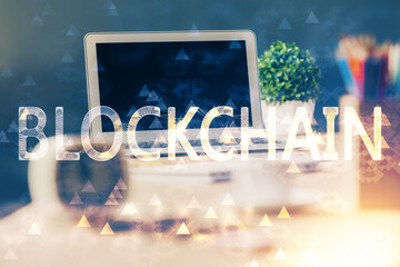 Double exposure of blockchain theme hologram and table with computer background. Concept of bitcoin...