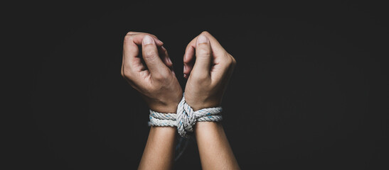 Woman hand tied up with rope, depicting the idea of freedom of the press or freedom of expression...