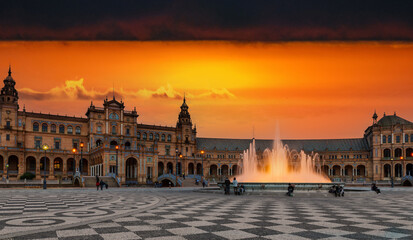 Fototapeta premium Spanish plaza sunset with fountain in Seville