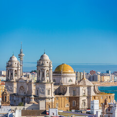 Fototapeta na wymiar Cadiz Cathedral under clear blue sky for text space