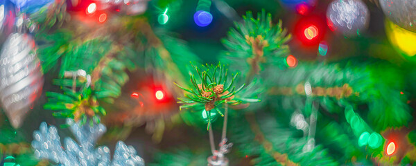 Bright christmas tree with decorations and colorful lights, soft focus blurry background