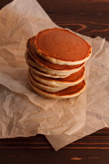 Pancakes on white paper background